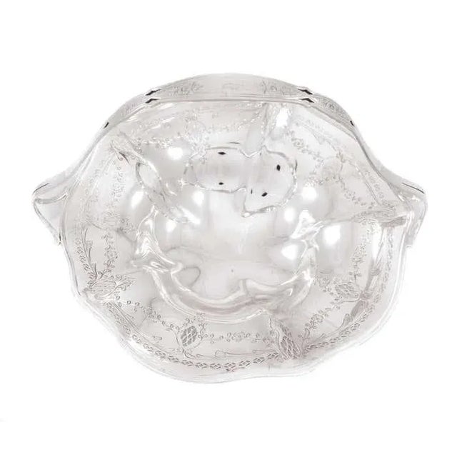 We are delighted to offer this sterling silver basket by Frank Whiting silver. It has a cutout design along the fluted...