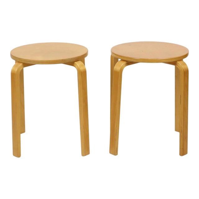 A lovely set of two vintage IKEA stools—the 'Frosta' model—crafted from bent beech plywood. These easily stackable stools...