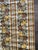 Apples, berries and flowers Browns and gold with off white background Stripes Vinyl, some texture to surface Not pre-...