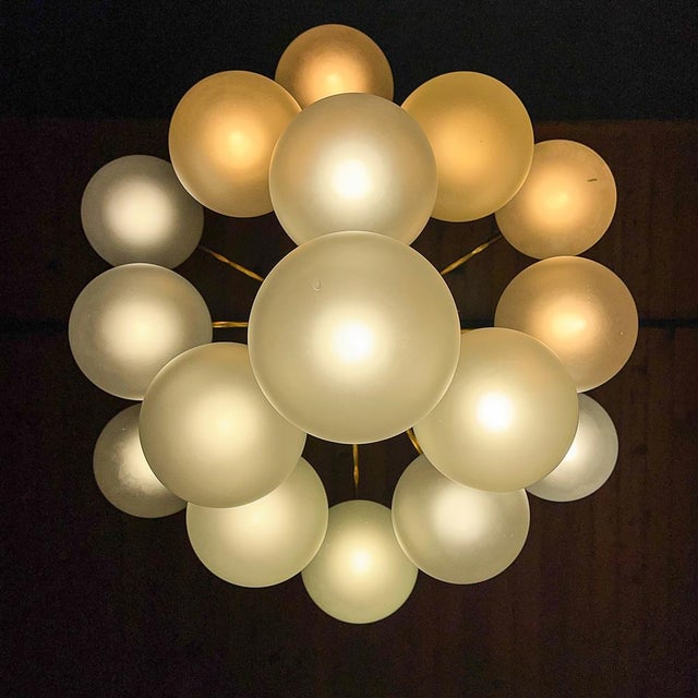 Introducing a striking piece of mid-century modern artistry: the modern ball chandelier by Orion Austria, crafted during...