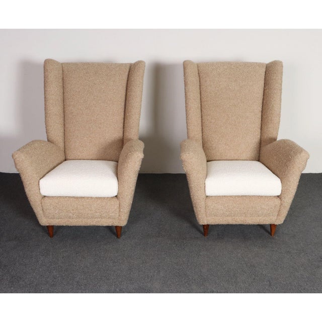 Modernist high back chairs supported by sculptural, walnut feet (circa 1950s, Italy). Aesthetically distinctive, striking...