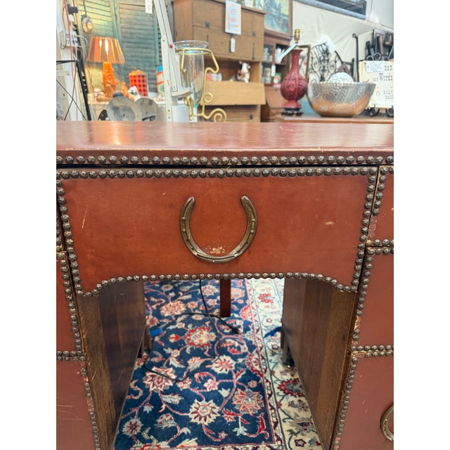 A highly distinct mid-20th century pedestal desk executed in a rugged Western Campaign style. Perfect for a ranch house,...