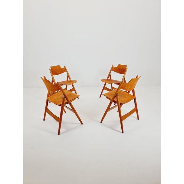 Austrian folding walnut chair model SE18 by Egon Eiermann for Wilde & Spieth set of 4 Designer: Egon Eiermann...