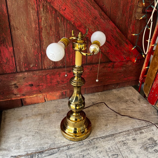This vintage brass lamp exudes timeless charm with its dual sockets and pull chains. At 20 inches tall, its elegant design...