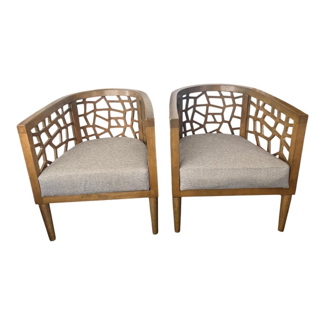 A Pair Mid-Century Modern Inspired Teak Fretted Barrel Tub Chairs For Sale