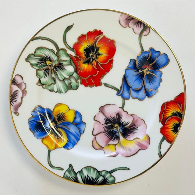 Vintage fine porcelain Fitz and Floyd "Pansies" dessert plates. Set of four (4) plates trimmed in gold with gold gilt...