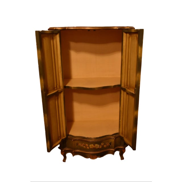 With a serpentine front and cabriole feet, this Venetian style cabinet boasts a charming silhouette as well as gorgeous...