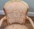 Elegant pair of French Louis XV style giltwood fauteuil armchairs Each chair features a shaped upholstered back within a...