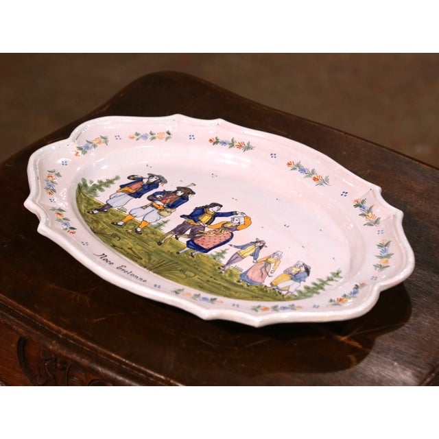 This charming antique wall platter was hand-painted in Brittany, France, circa 1900 by the HB Quimper workshop. Oval and...