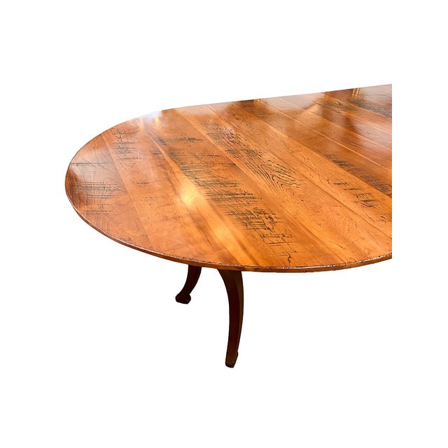 This beautiful cherry dining table can seat up to eight people. It can stand as a circular table or as a long oval when...