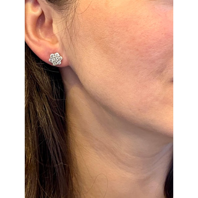 A sweet, shimmery style for any day of the week. These stud earrings blossom floral clusters of 2.8 ct. total weight....