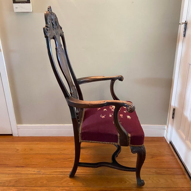 Late 18th century Chippendale-style or Queen Anne-style walnut armchair from the Renaissance Revival era with an ornately...