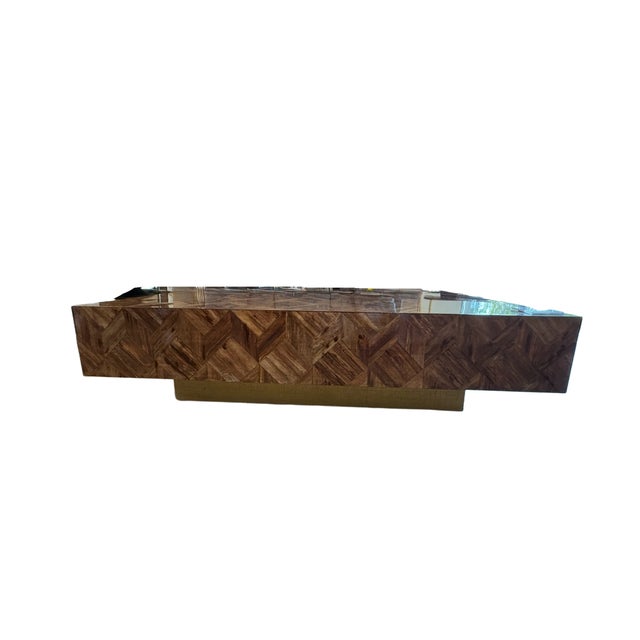 The stunning Made Goods Lesandro Coffee Table comprised of natural banana bark, arranged in a herringbone pattern across...