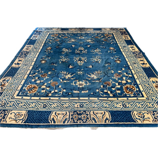 This striking 1920s antique Chinese Art Deco rug is a beautifully composed room-size carpet measuring approximately 11'4"...
