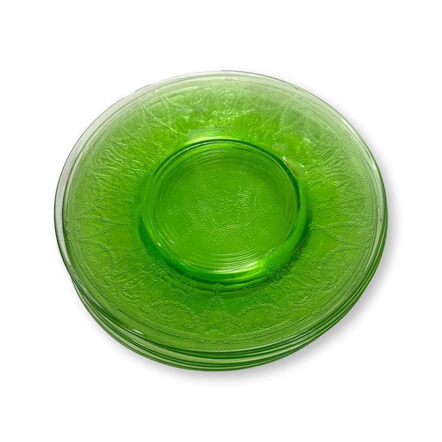 A vibrant set of eight Anchor Hocking Cameo Green luncheon plates dating to the 1930s. Crafted in luminous Uranium glass,...
