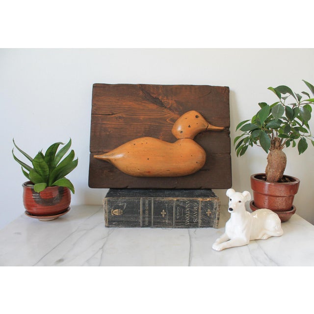 Vintage hand carved wood duck sculpture wall hanging. No makers mark. Minor age wear. Ready to hang.