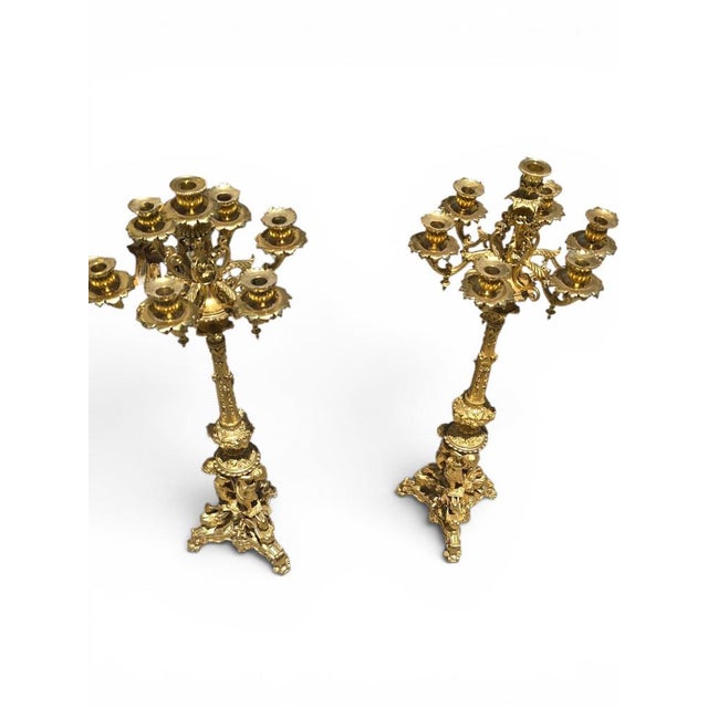 Exceptional pair of monumental gilt bronze candelabra dating from the 19th century, distinguished by their impressive...