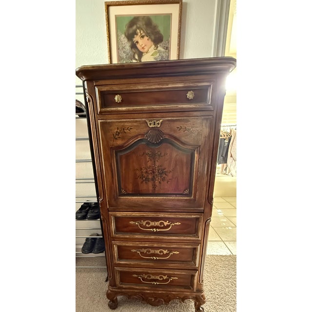 A charming French Provincial jewelry chest and petite secretary cabinet from the “Brittany Collection” by Drexel Heritage....