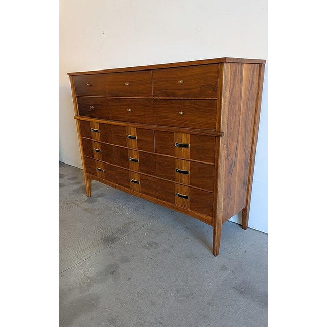 DESCRIPTION: This is a true statement piece — a large-scale mid century modern highboy dresser with an uncommon fifteen-...