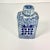 This Chinoiserie Square Ginger Jar features a hand-painted Happiness symbol on two sides. It also has an overall swirled...
