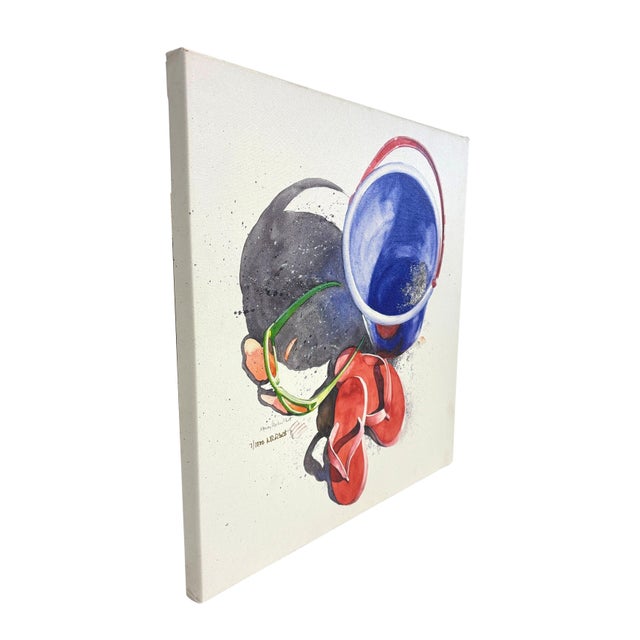 Pair of prints of watercolors. "Beach Ball" and "Beach Bucket" by Nancy Ricker Rhett. Rhett is a watercolor artist who...