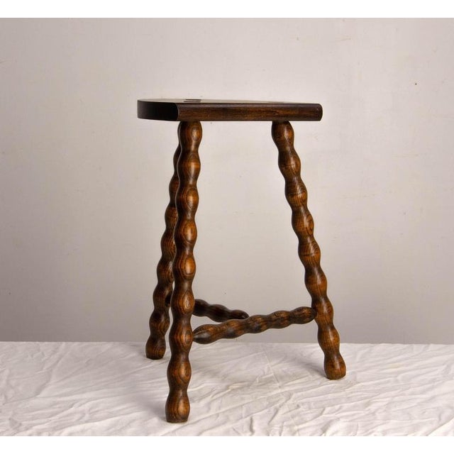 Three-legged cowherd’s stool made of turned beech, France, circa 1960 French cowherd’s stool made circa 1960 from solid...