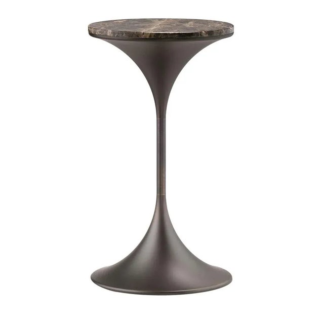 Captivating curves trace the sculptural trumpet-like silhouette that defines this side table, an exclusive design inspired...