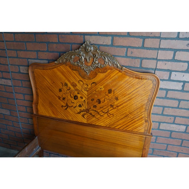 French provincial charm and vintage appeal. Lovely floral inlay veneer on the headboard and the top is adorned with a...