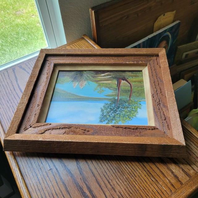 This vintage original acrylic still life painting landscape features serene yucca trees near a river. The small framed...