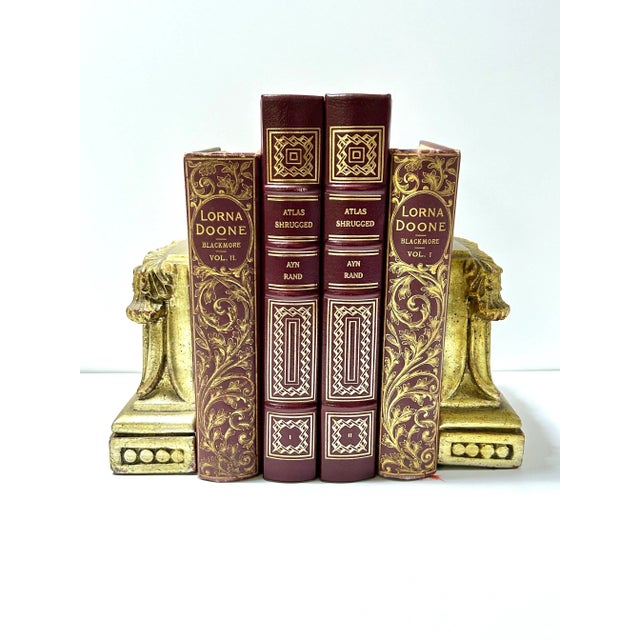 A handsome pair of vintage bookends designed in the style of classical Corinthian columns. The sculptural architectural...