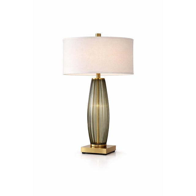 Extra-tall ribbed smoky glass table lamps with solid brass bases and architectural presence. Estate-sourced and...