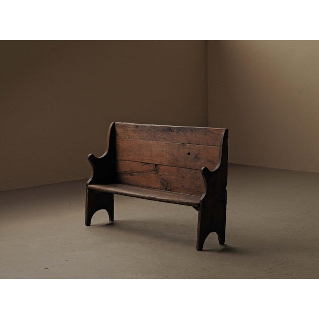 Solid wood farm bench from the Aubrac region is a fine example of 19th-century French folk art furniture. It features a...