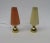 1 pair of small table lamps from the 50s with pleated plastic shades and brass base. Interesting about these two lamps is...