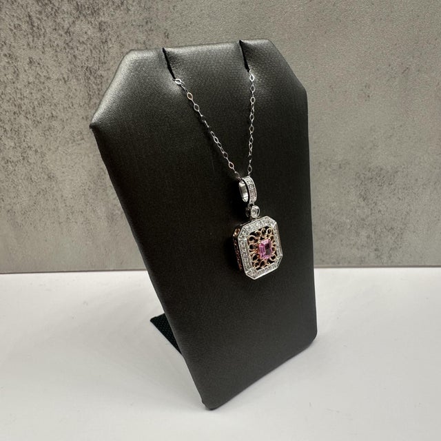 This elegant pink sapphire and diamond necklace features a beautiful blend of 14kt white gold with a 14kt rose gold...