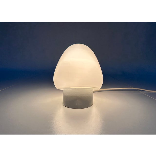 This iconic model 'erdbeere' strawberry-shaped wall light was created by the famous german designer wilhelm wagenfeld...