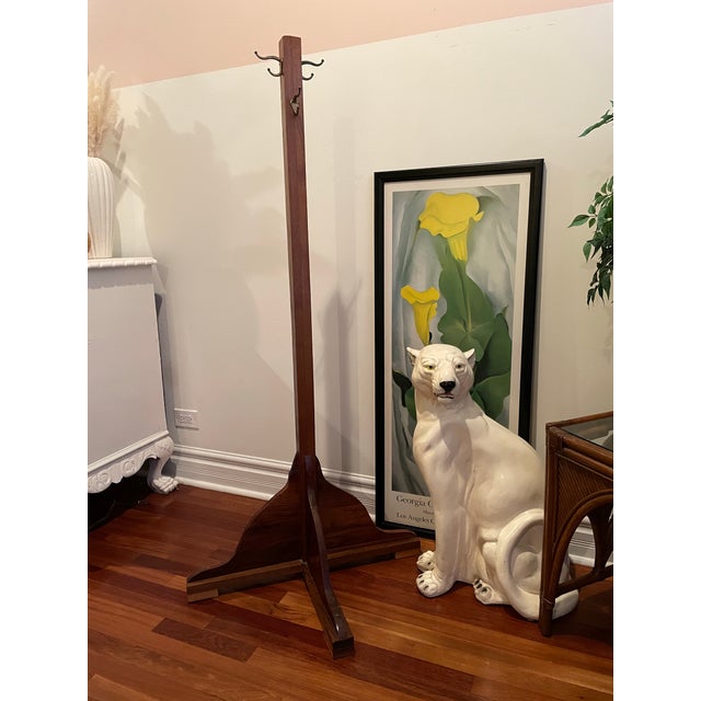 A substantial late 19th–early 20th century coat stand featuring traditional overbuilt construction and a commanding...