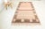 This is a vintage Turkish Oushak rug from the Mid 20th Century. The piece was hand-knotted.