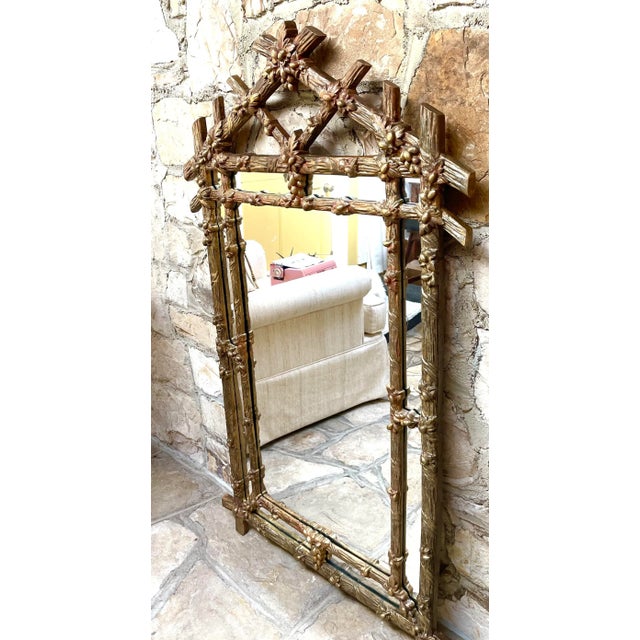 This lovely ornate gold wood carved mirror with oak foliage & acorns is attributed to Friedman Brothers. Includes bracket...