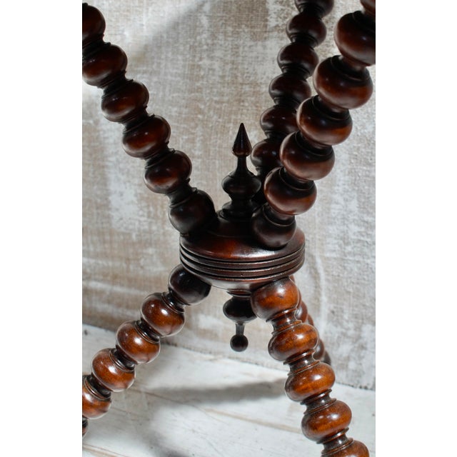 A beautiful Victorian bobbin turned gypsy table. Made from beech, with a leather top, and brass stud work around the edge,...