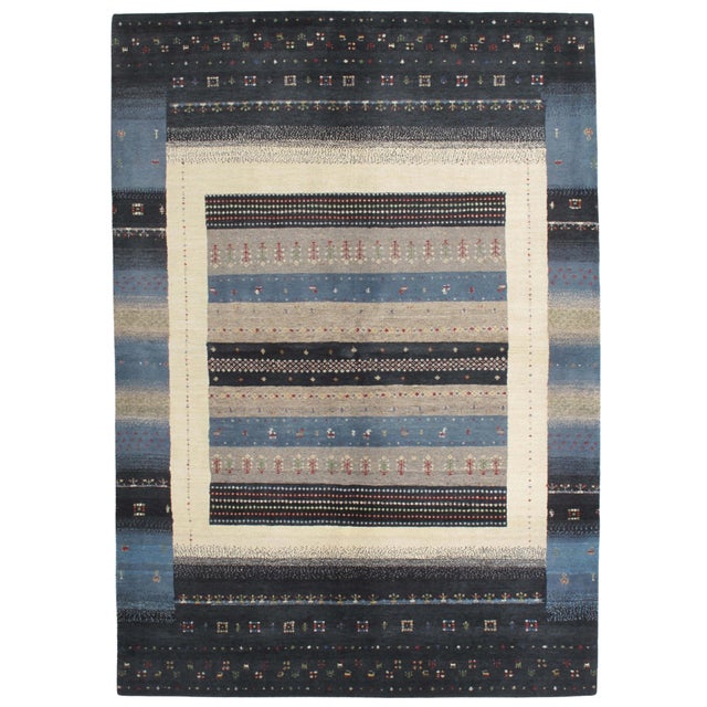 Vintage Hand-knotted Gabbeh rug featuring a layered, banded composition framed by a bold border. The design incorporates...