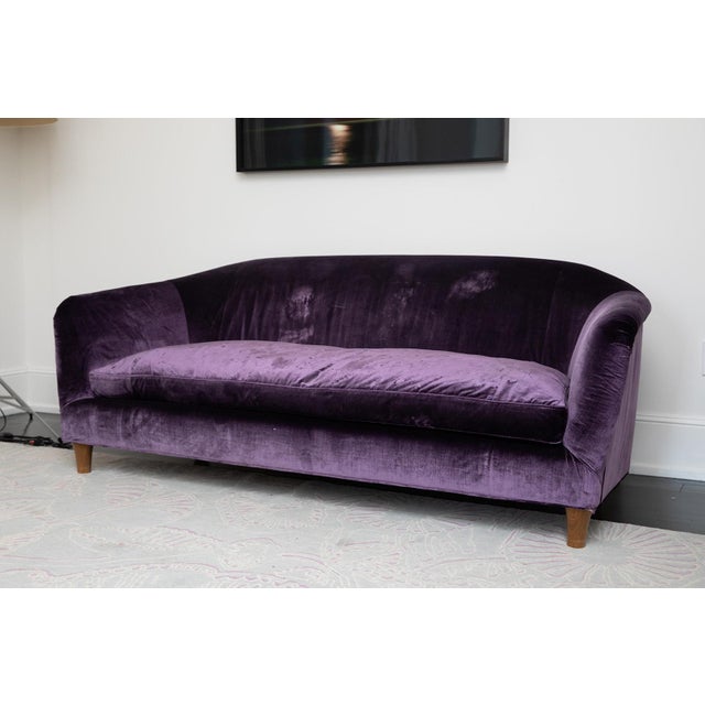 A bespoke upholstered sofa designed by Christopher London