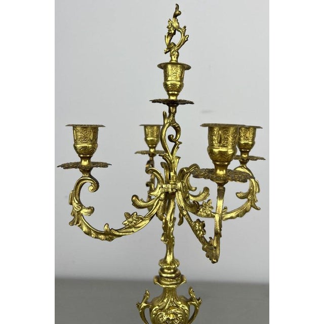 An impressive Vintage set of brass candelabras , featuring an elaborate matching design with sweeping candle arms, floral...