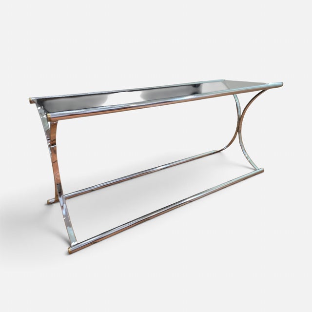 ▪️Maison Jansen Chrome Smoked Glass Console Table ▪️Beautiful accent piece features a chrome and glass construction ▪️The...