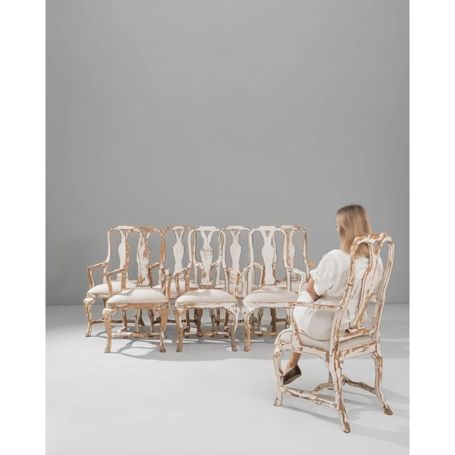 This set of eight 20th Century Swedish Rococo Revival dining chairs presents an elegant blend of sculptural form and...