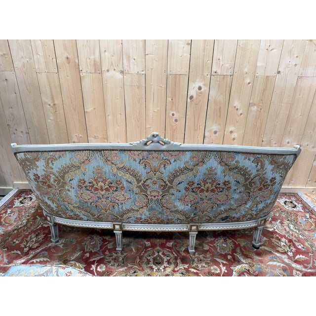 A Louis XV style living room set comprising a three-seater sofa and two matching armchairs. The solid wood frame is...