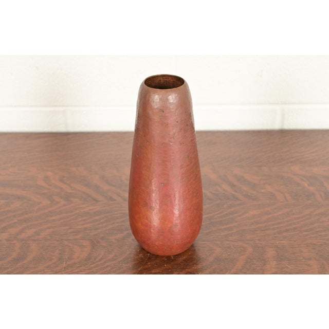 A gorgeous Arts & Crafts hand hammered copper vase In the manner of Roycroft By Ramon Ramirez Mexico, Mid-20th Century...