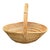 A striking large-scale handwoven split reed rattan basket featuring an elegant sculptural silhouette and dramatic arched...