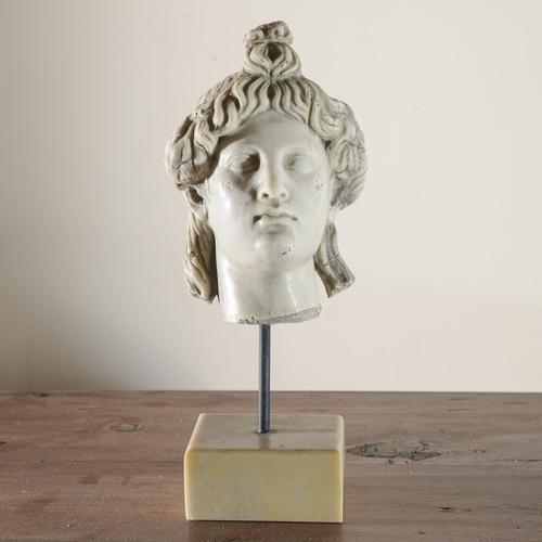 This refined ceramic bust of apollo represents a classic example of period decoration inspired by greco-roman antiquity....