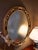 Vintage Federal Revival Black and Gold Parcel-Gilt Oval Wall Mirror For Sale In Greensboro - Image 6 of 6
