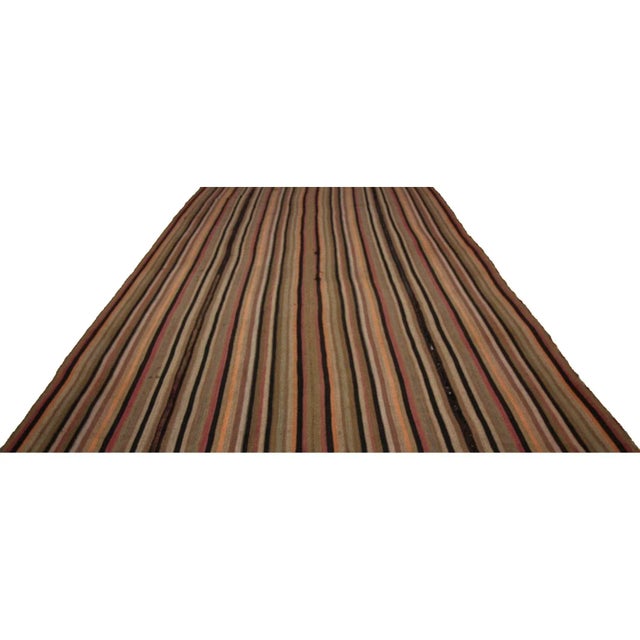 Handwoven vintage striped kilim rug from Kars region of Turkey. Approximately 60-70 years old.